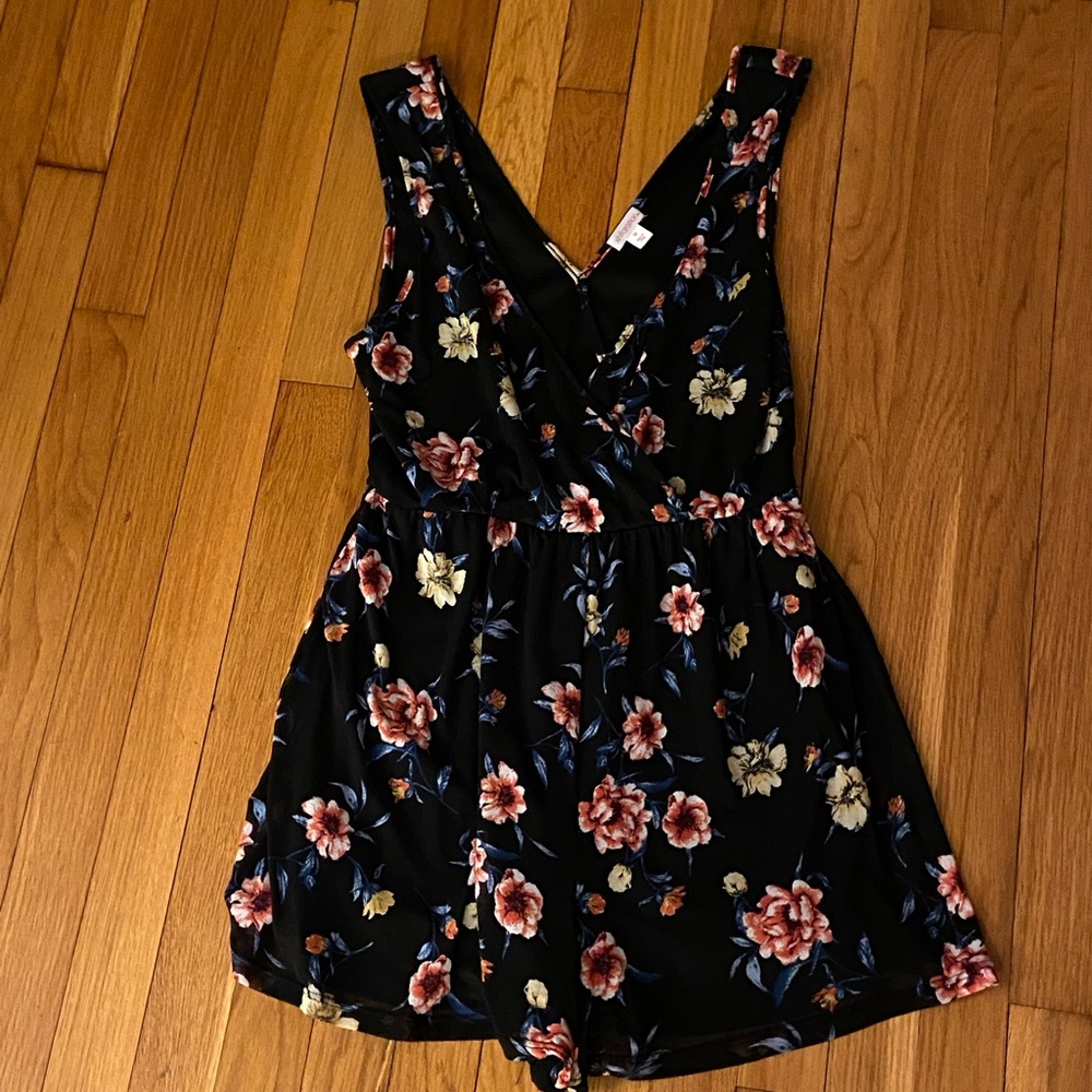 Black floral romper. Stretchy, comfortable material. Thick, reliable fabric.